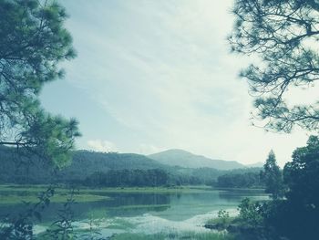 Scenic view of lake with mountains in background