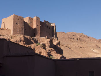 Low angle view of buildings against blue sky