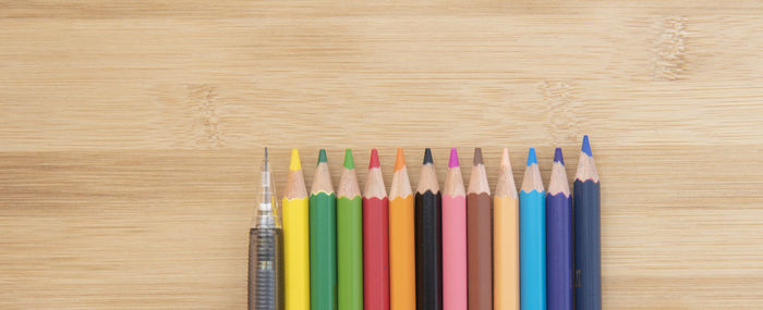 Close-up of multi colored pencils on table