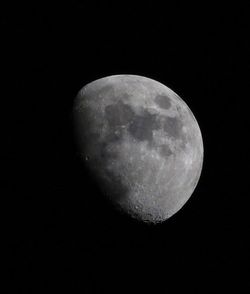 Low angle view of moon against clear sky at night