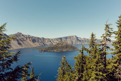 Scenic view of mountains against clear blue sky