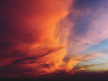 Low angle view of dramatic sky during sunset