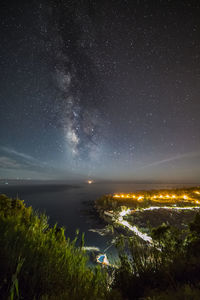 Scenic view of illuminated star field against sky at night