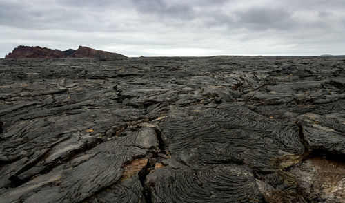 Scenic view of volcanic landscape against sky