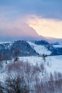 Scenic view of mountains against sky during winter