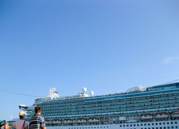 Low angle view of buildings against clear blue sky