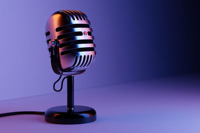 Close-up of microphone against blue background