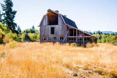 Abandoned house against clear sky