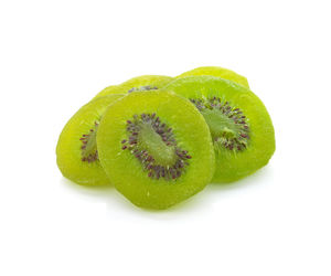 Close-up of green fruit against white background