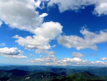 Scenic view of landscape against blue sky