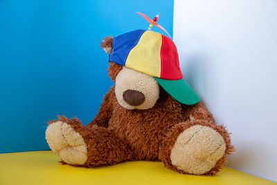Close-up of stuffed toy against blue background