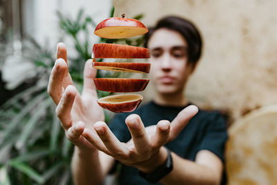 Midsection of person holding fruits
