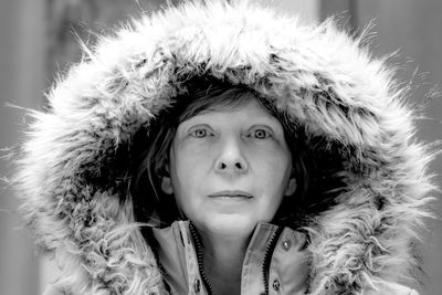 Close-up portrait of mature woman wearing fur jacket