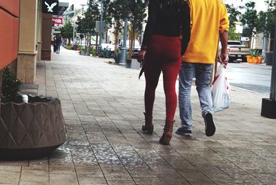 Woman standing on sidewalk