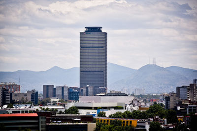 Modern buildings in city against sky