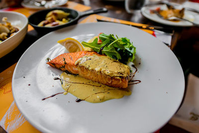 High angle view of fish in plate on table