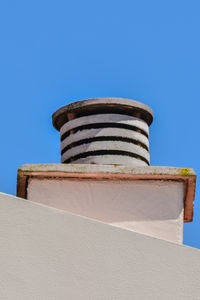 Low angle view of building against clear blue sky