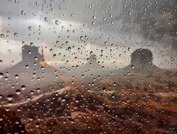 Full frame shot of wet glass window during rainy season