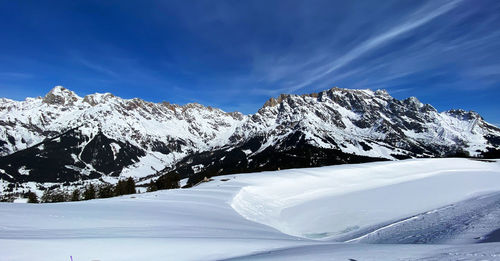 Scenic view of snowcapped mountains against sky