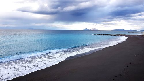 Scenic view of beach against sky