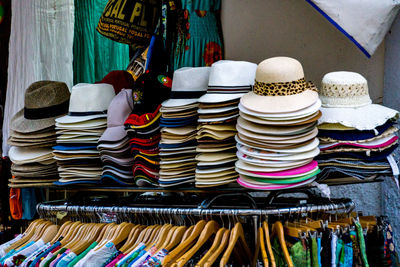 Stack of clothes hanging in store