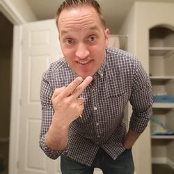 Portrait of smiling man standing at home