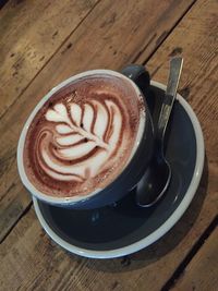 High angle view of cappuccino on table