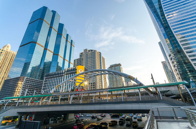 Low angle view of modern skyscrapers against sky