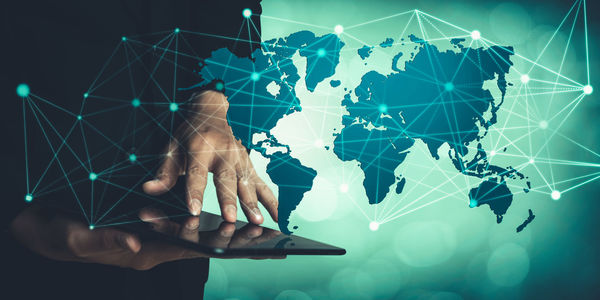 Digital composite image of hands and woman using mobile phone