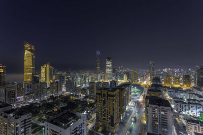 Illuminated buildings in city at night