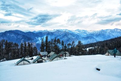 Scenic view of snowcapped mountains against sky
