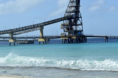 View of pier over sea against sky