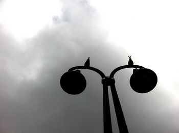 Low angle view of street light against sky