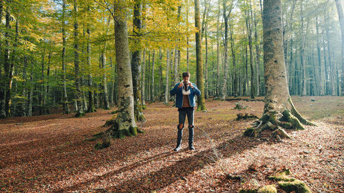 Boy walks with vr viewer in the mountains in autumn