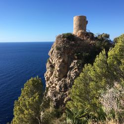 Scenic view of sea against clear blue sky