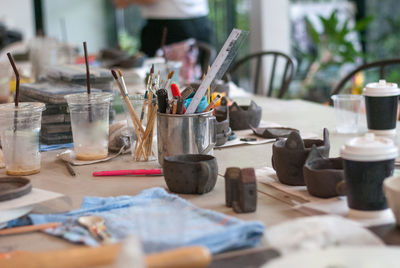 Close-up of paintbrushes on table