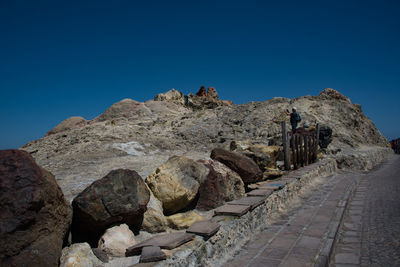 Rocks against clear blue sky