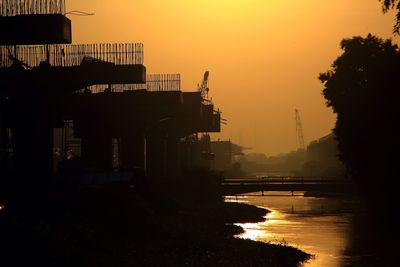 Scenic view of river at sunset