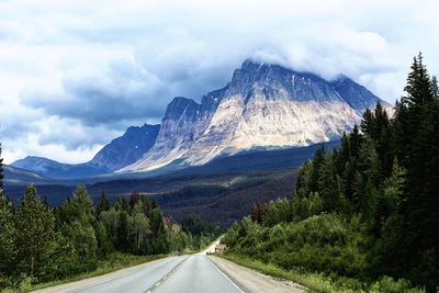 Country road leading towards mountains