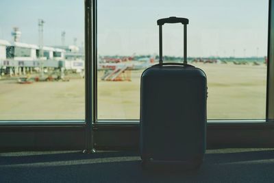 Close-up of glass window against sky