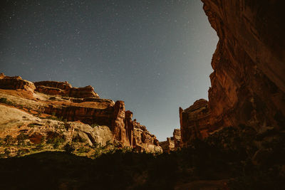 Moonlight on the canyon walls under starry skies of the maze utah