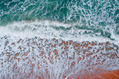 Surf on shore at beach