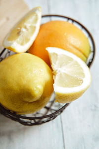 Citrus fruits prepared in a metal basket for summer cocktails