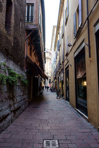 Narrow alley amidst buildings in city