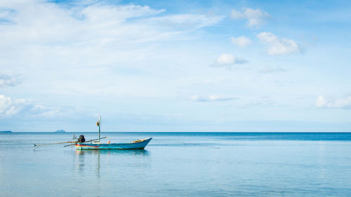 Boat in sea against sky