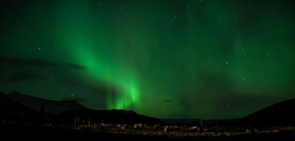 Scenic view of mountains against sky at night