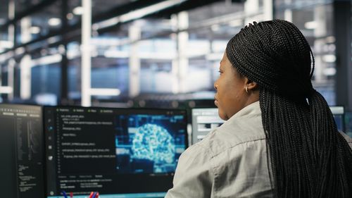 Side view of man looking at airport