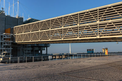 Low angle view of buildings against clear blue sky