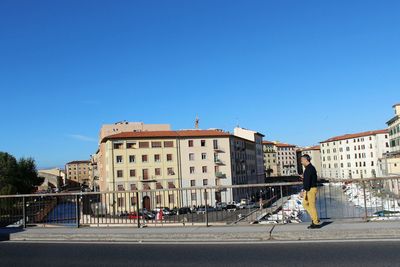 Full length of woman standing in city