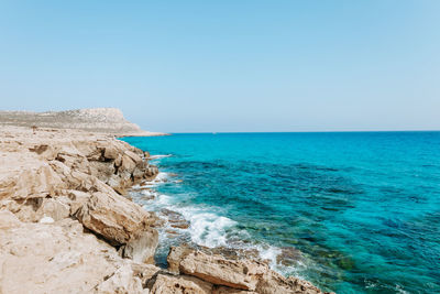 Scenic view of sea against clear sky